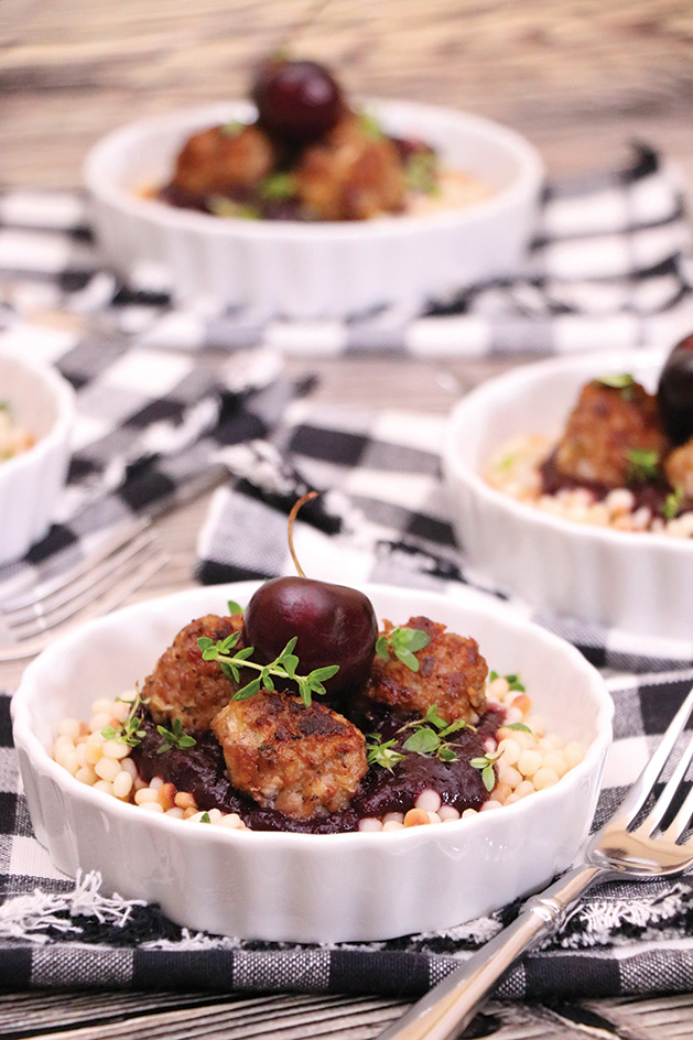 Herbed Duck Meatballs with Cherry, Apple Red Wine Sauce and Toasted Couscous