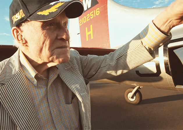 Lieutenant Charles Woehrle, at age 95, stands in front of a B-17.