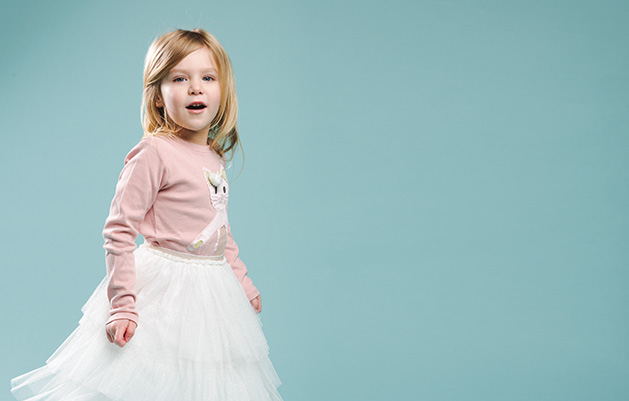 A child models clothing from Honey P's Boutique.