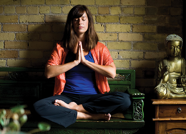 Nicole Lovald, owner of Spirit of the Lake Yoga and Wellness Center, meditates