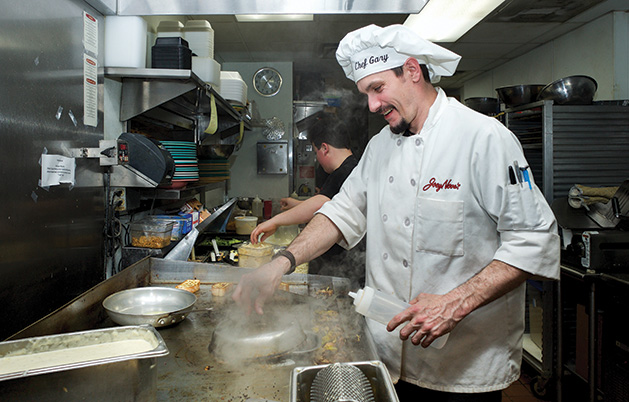 Chef Gary Ezell cooking on the line.