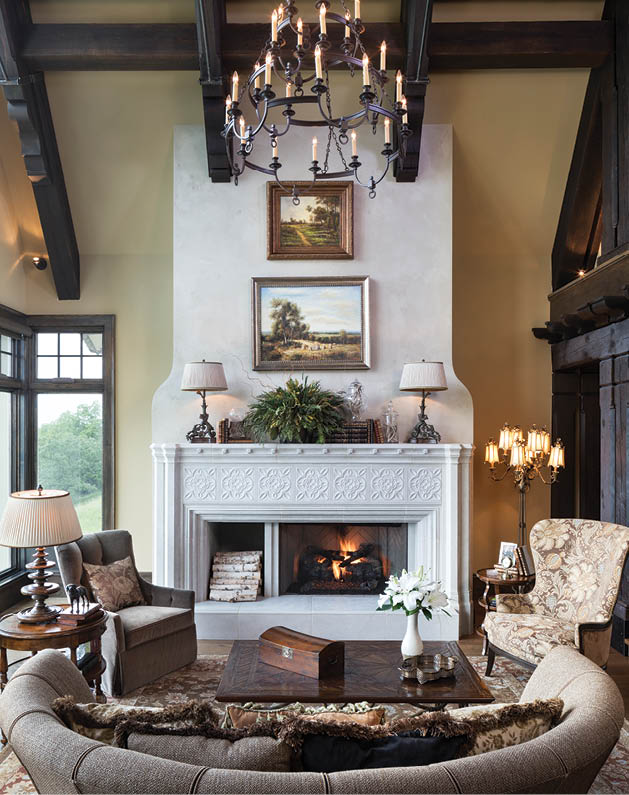 (The Manor House Interiors team designs spaces that fit each client’s style, like this stunning great-room hearth; Photo by Landmark Photography)