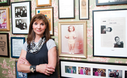 Nancy Golden's work room in her Minnetonka home is lined with family photos, clippings and meaningful art. She's wearing two Golden wear 48-inch link neckaces (start at $175) and a two-snap wide cuff ($175-$225). 