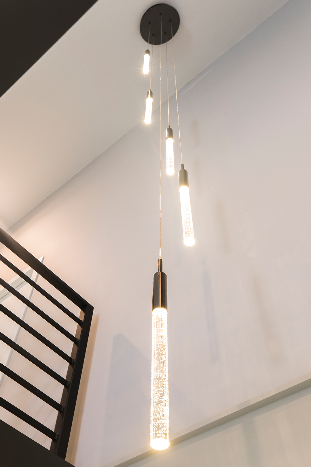 A decorative light fixture adds style while illuminating both levels.