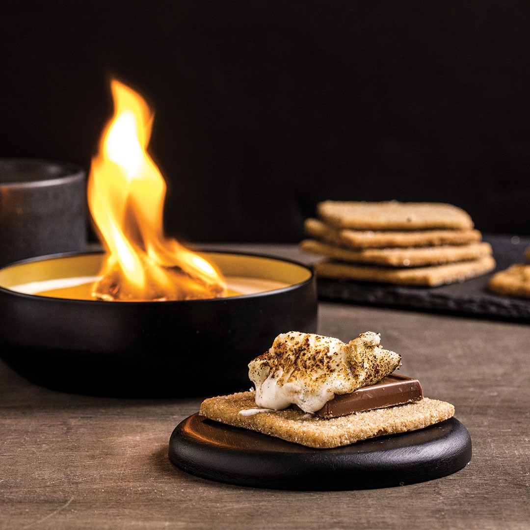 “We’re not just a food company,” Mike Nelson says. “We’re all about the experience.” That includes s’mores kits and The Travel Campfire, satisfying sweet tooths wherever they might find themselves.