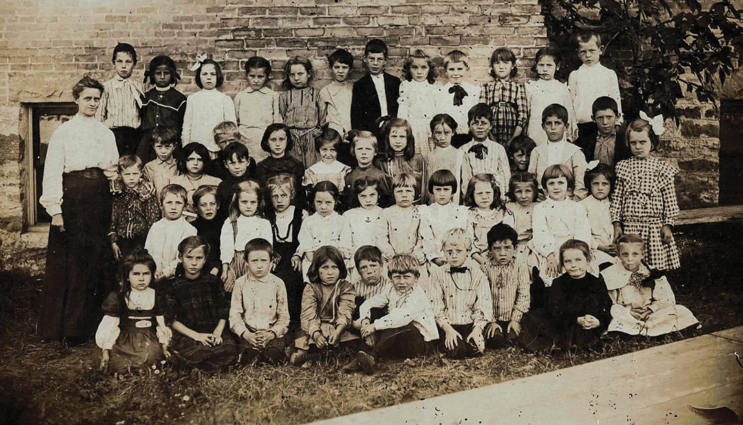 Ella Stratton is photographed with her 1904 first grade class near Excelsior Public School, which still stands at 261 School Ave., Excelsior. (From the Lake Minnetonka Historical Society archives.) 