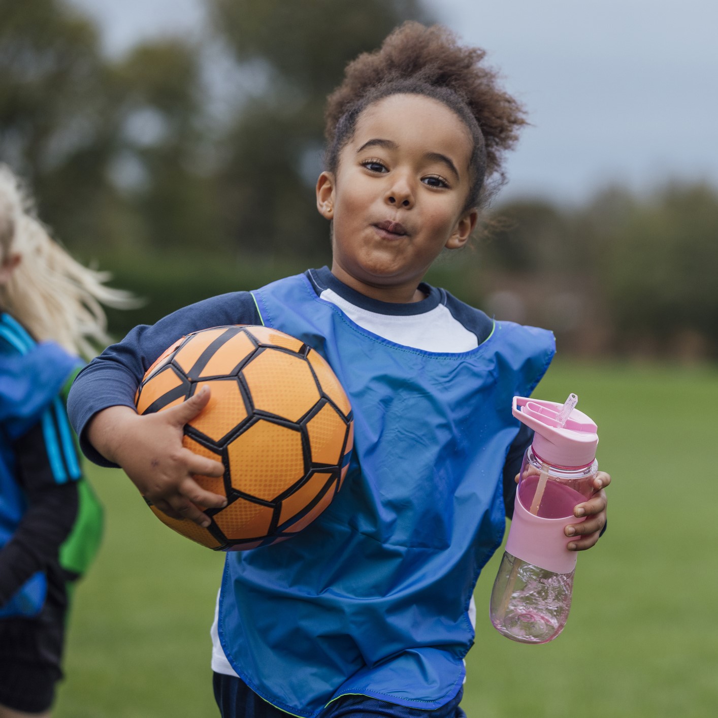 Young Athlete with Water Bottle