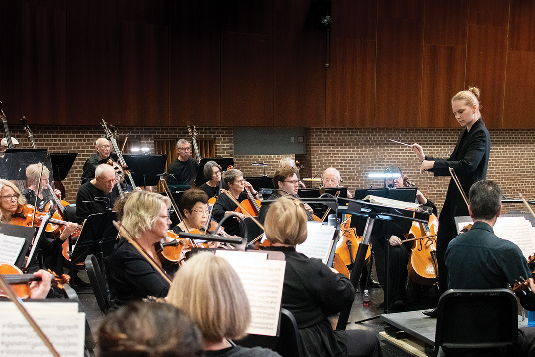 Hannah Schendel conducts the Wayzata Symphony Orchestra (WSO). The area native recalls attending WSO concerts as a child. 