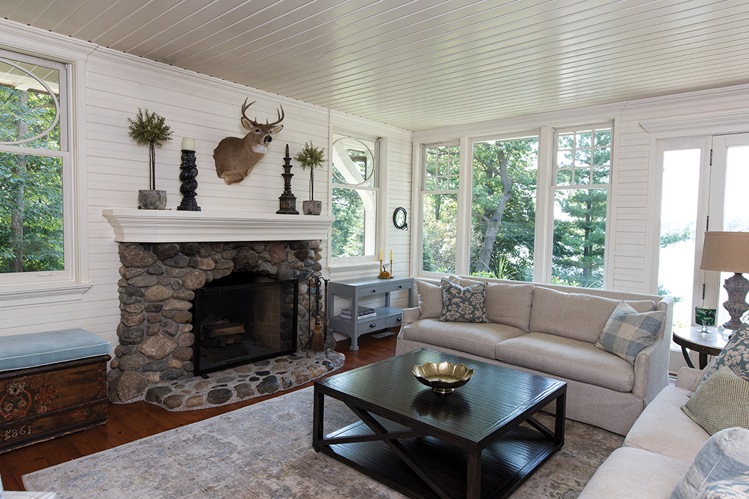 “It’s all wood walls inside, very cottage looking. We wanted to keep the vibe of the original house,” says Sue Gartner of their intentions while remodeling their lakeside home. 