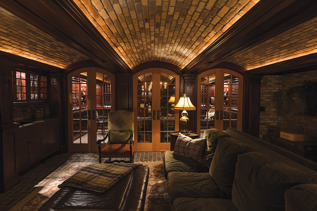 The wine cellar offers another unique setting, featuring a harvest table, which is ideal for sipping and dining, and accommodates up to eight guests. The ceiling and floor are brick, and mahogany offers visual warmth to the racking and cabinetry. 