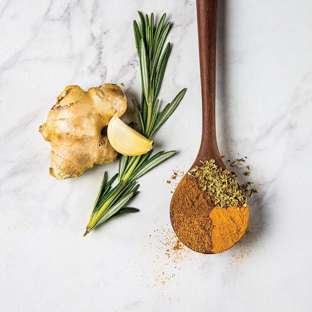 Spices in Spoons with Ginger, Garlic and Rosemary