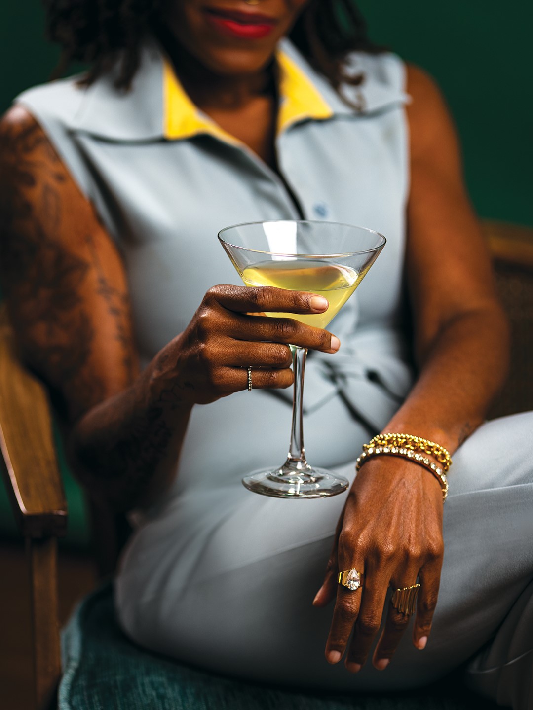 Jayded AF founder Alexa Fitzpatrick holding a cocktail