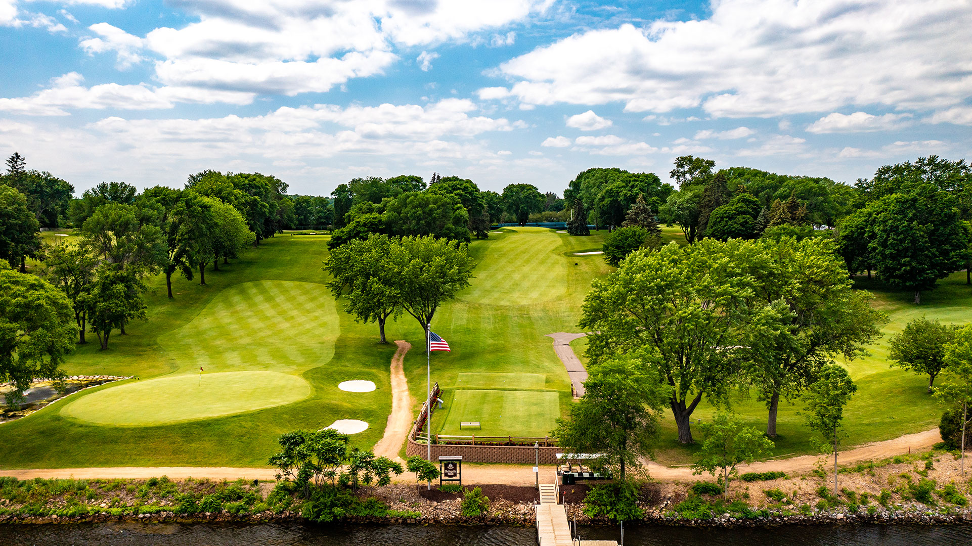 Golf course greens at Lafayette Club overlooking the lake.