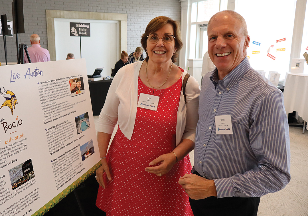 Woman and man at the Hammer & NER Reach for Ralph Fundraiser