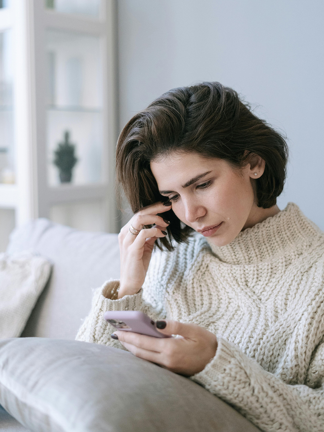Woman using phone app for therapy.