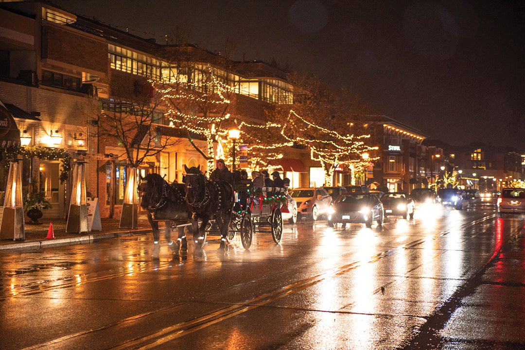 We can almost hear the clip clop of this horse-drawn wagon ride, making its way down Wayzata’s Lake Street. 
