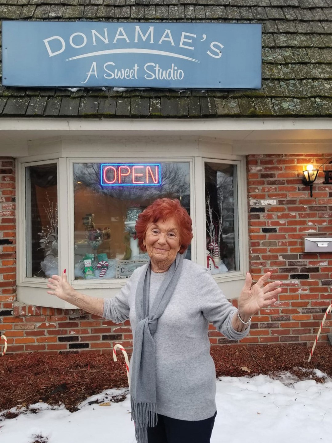 Donamae Koppelman stands in front of the candy business’s former storefront. She passed away in May, but she left an indelible mark, guiding Donamae’s into the future. 