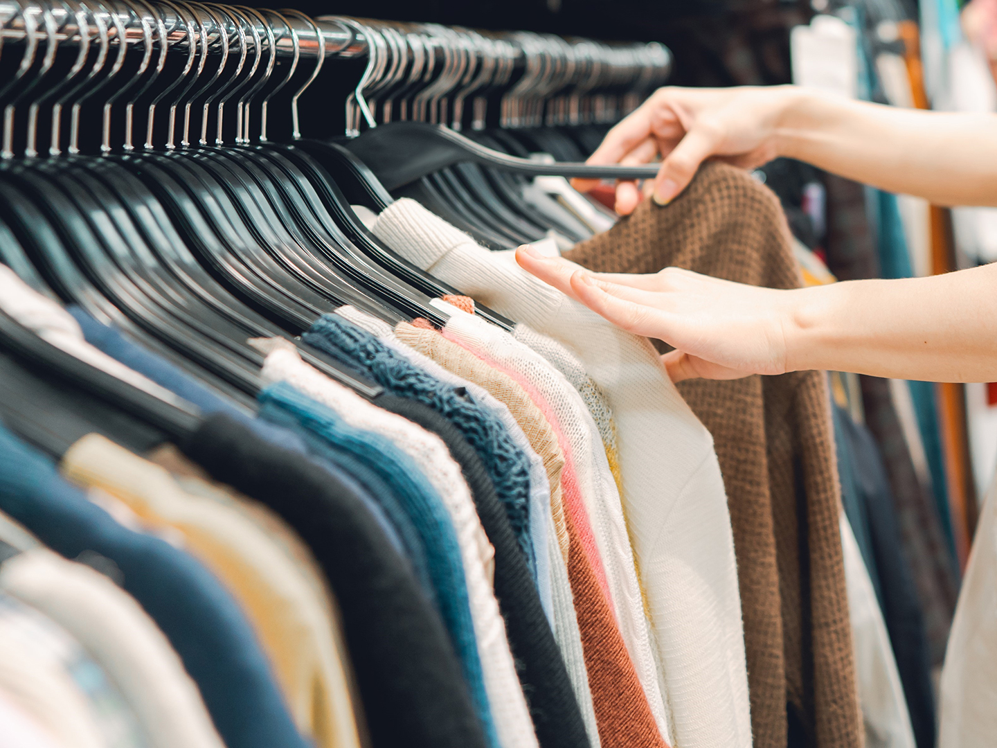 Woman at used clothes store