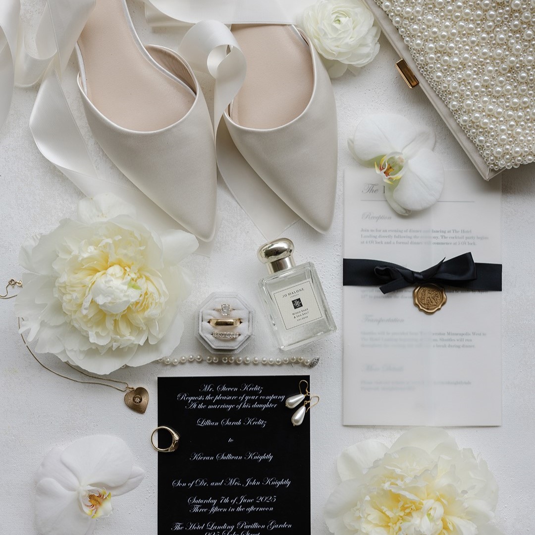 A classic black and white color story was carried through the wedding wear, dessert and, as shown here, the invitation suite. 