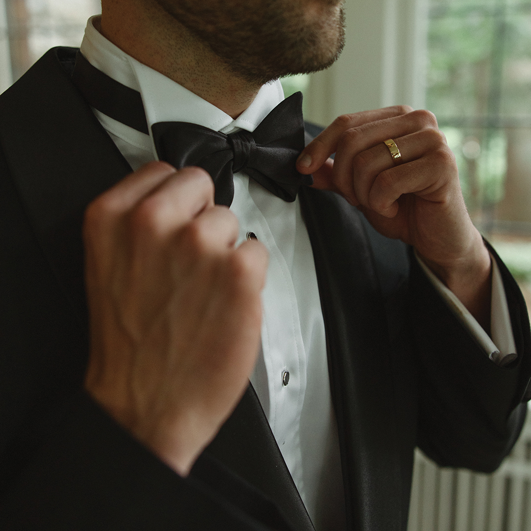 Adam straightening his tie