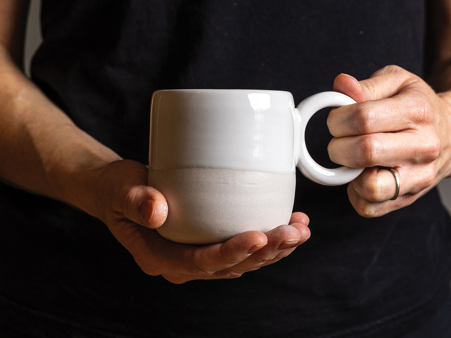 Danielle Uttecht holding a mug she made
