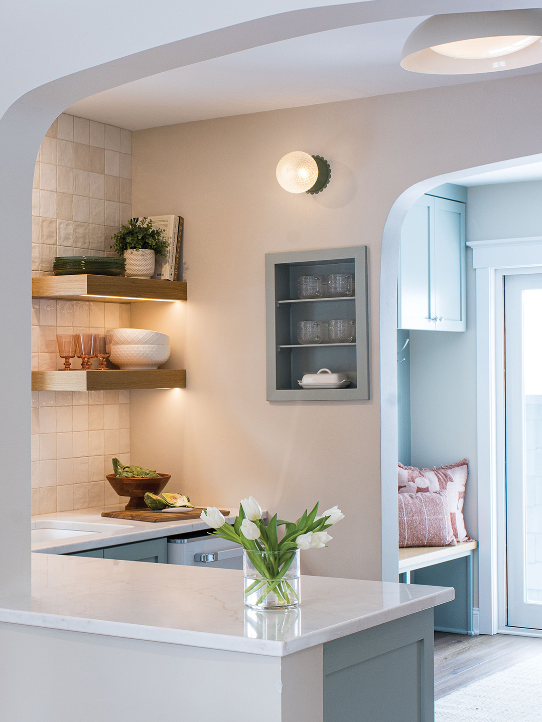 The goal was “a classic, timeless design with some pops of fun and whimsy,” designer and general contractor Kate Kadlec says. And the kitchen, which was originally closed off from the rest of the home, now connects to the main living area through a new arched opening.