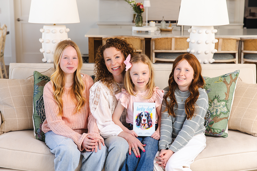 Mara Ryan and her children happily showcase her debut book. 