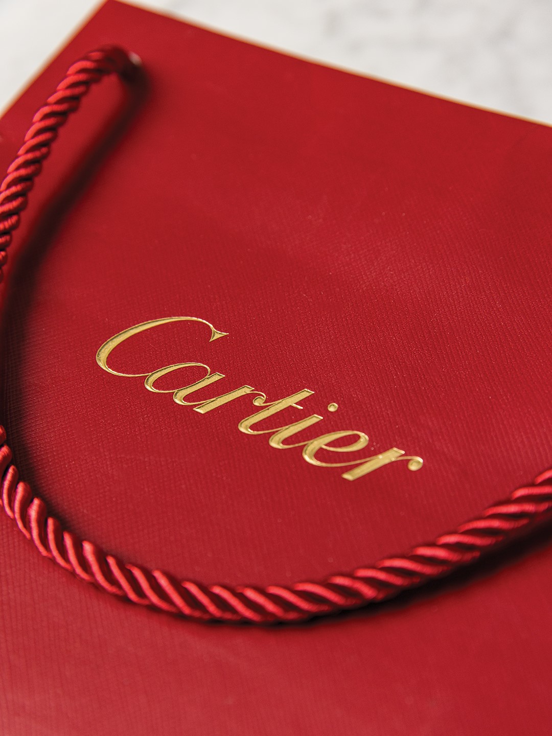 Red Cartier shopping bag