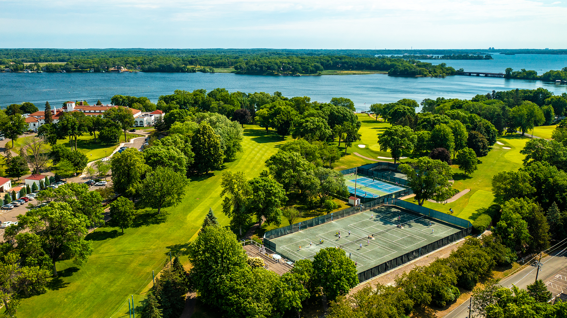 An aerial view of Lafayette Club's clubhouse, courts and golf course.