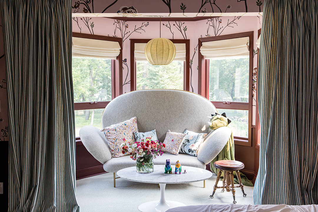 A child’s bedroom offers an opportunity for whimsy, as illustrated in this charming vignette, combining unique furniture with children’s elements.