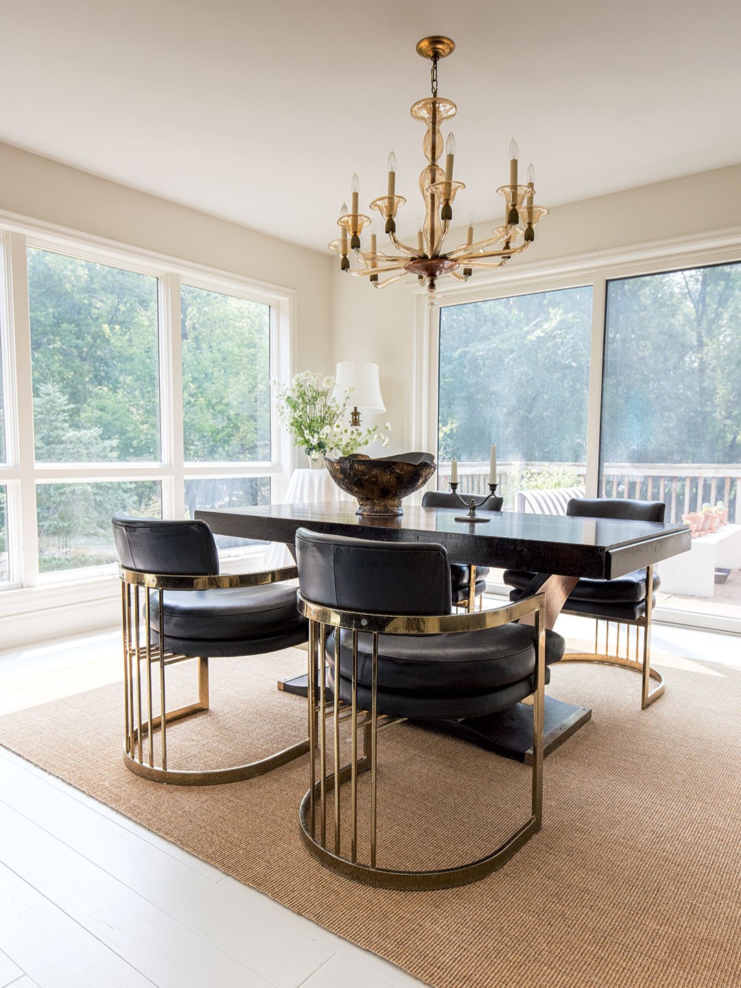 Dining room furniture needn’t stay seated in pure function. Jenny Jorgensen’s choices to include vintage brass barrel chairs recovered in leather and a vintage Murano chandelier lean into an art form all their own.