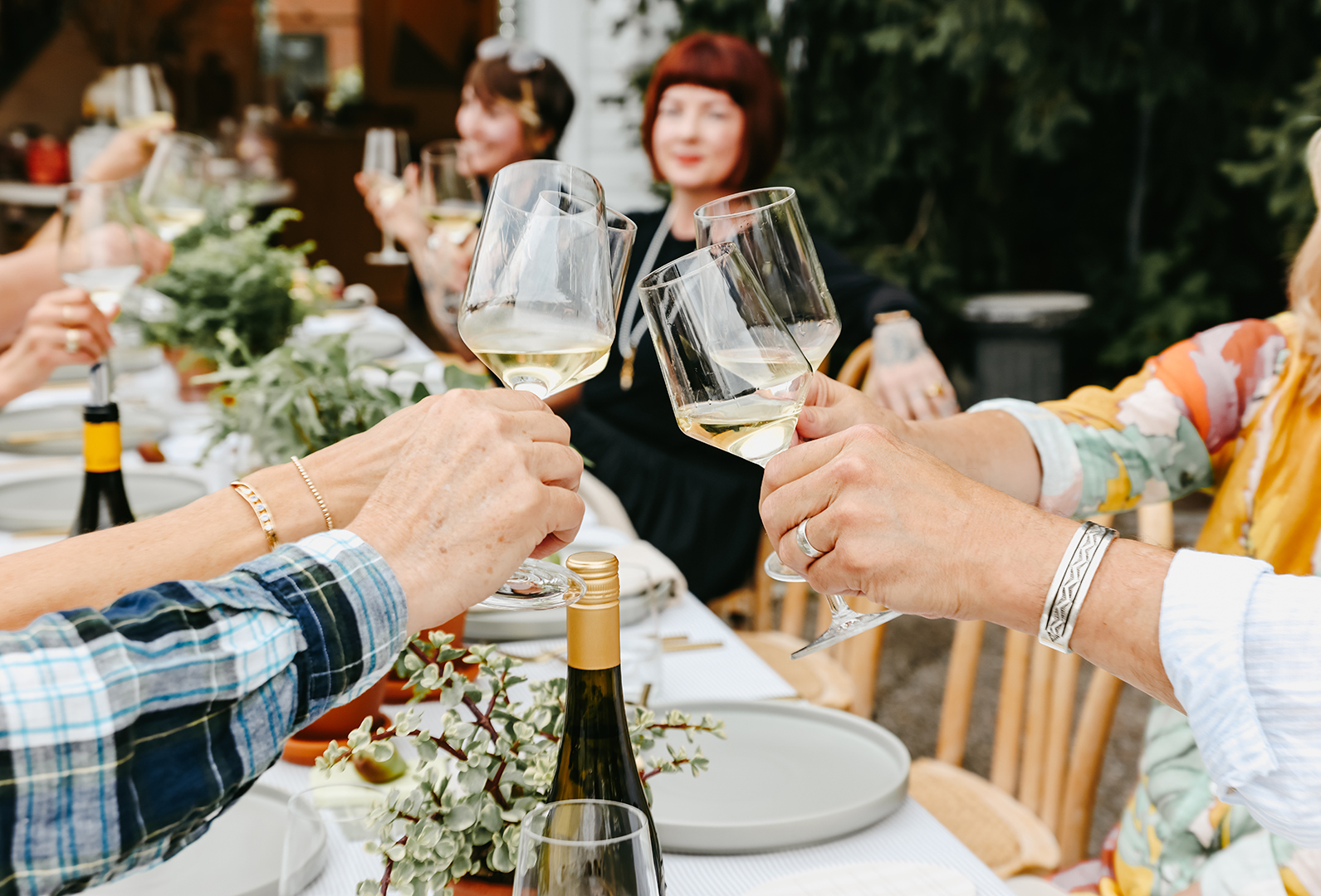 People toasting at July Gathered