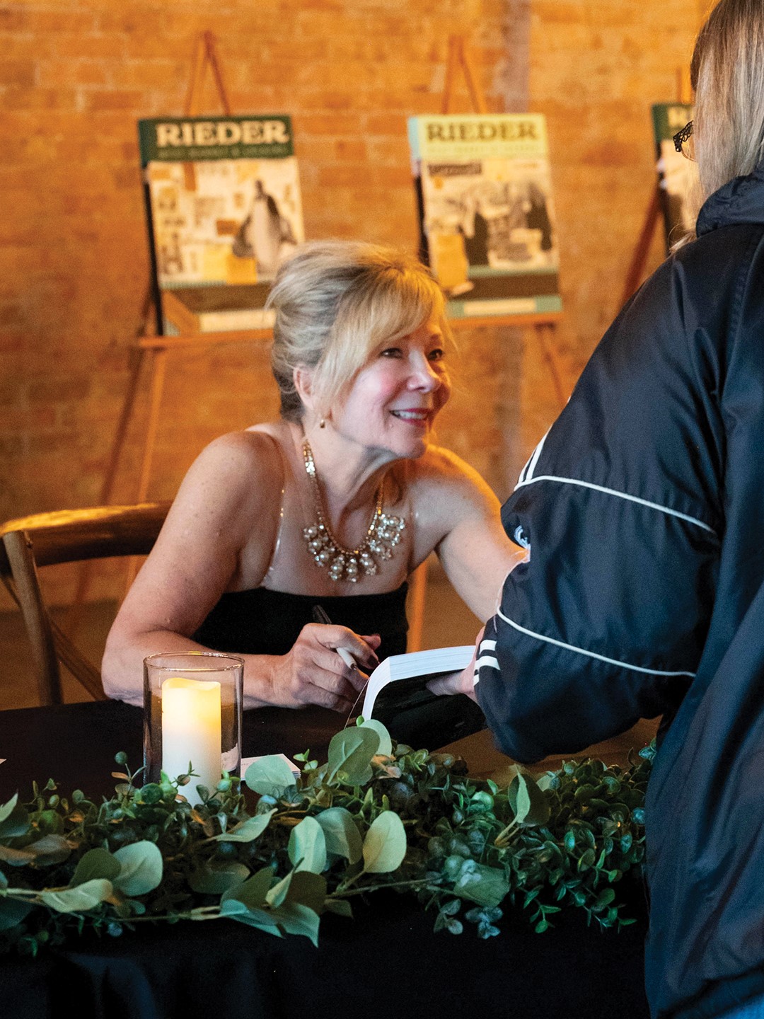 A book signing for local author Marcia Brakke’s Delano on the Crow: 150 Years of Unrivaled Spirit brings out community members and history buffs alike. 