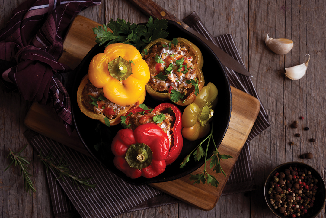 Bell peppers of different colors stuffed with ground meat